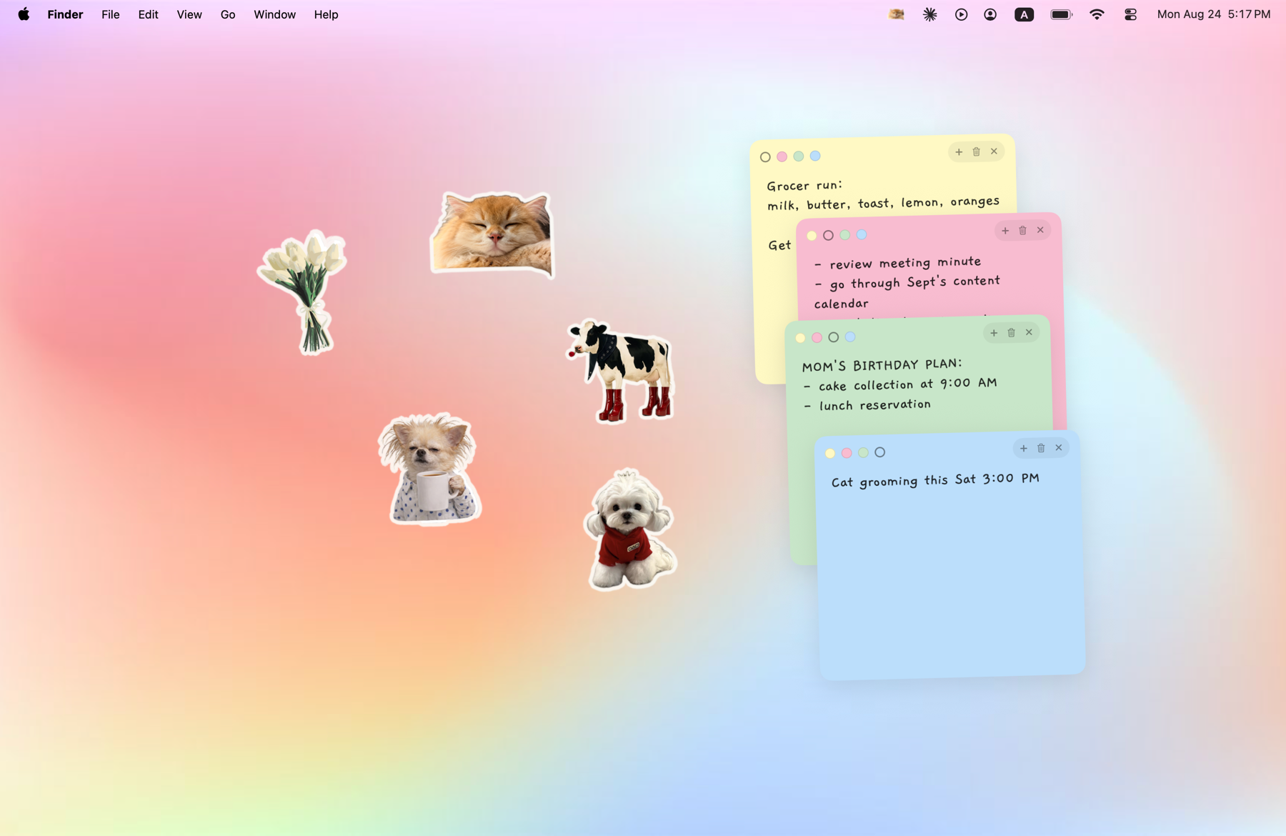 Five cut-out stickers scattered across a Mac desktop — a cat, a dog holding a mug, a cow, a bunch of tulips and a small white dog in a jumper — with four coloured sticky notes beside them